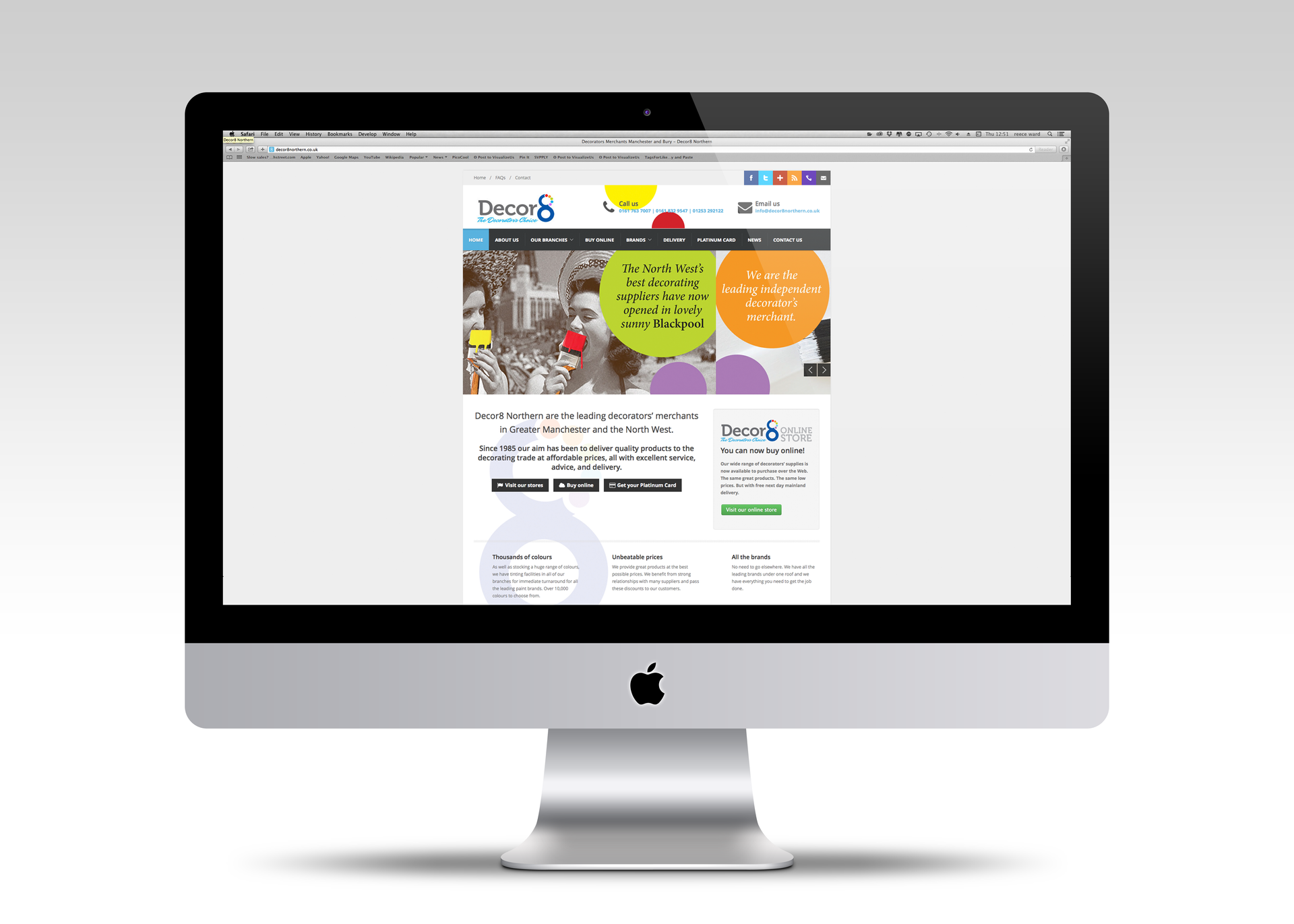 A modern desktop computer displaying the website of a professional services firm with a colorful, graphic-heavy homepage.