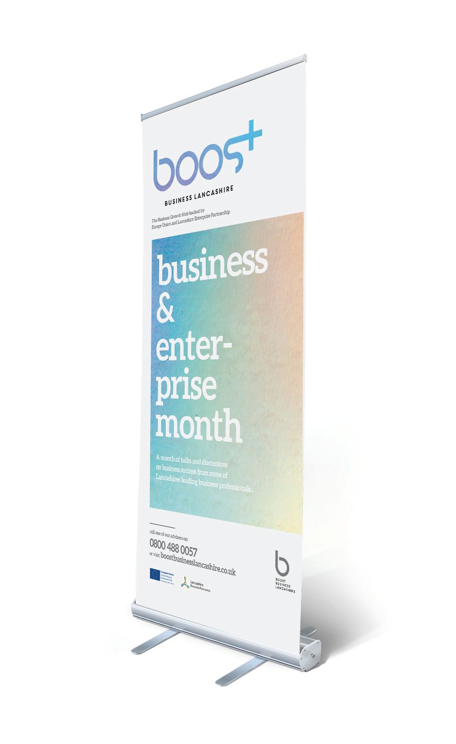 A white pull-up banner displays 