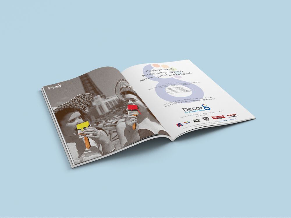 An open magazine mockup displaying a black-and-white photo of people eating ice cream, with promotional text on the right.