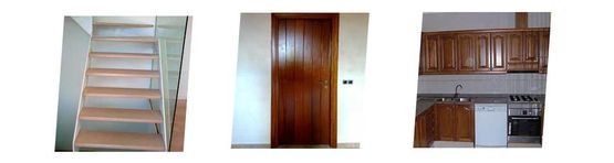 Escalera, puerta de madera y muebles de cocina en una casa.