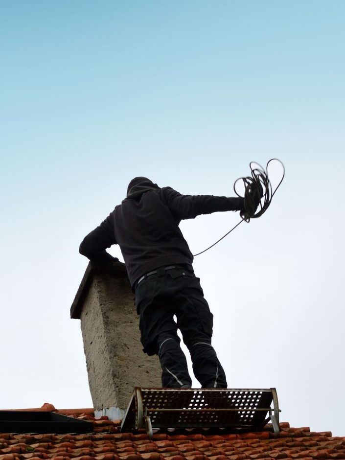 Ramonage d'une cheminée par un professionnel