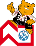 Ein Teddybär sitzt auf einem Hausdach und zeigt mit dem Daumen nach oben.