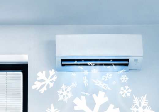 A wall mounted air conditioner with snowflakes coming out of it