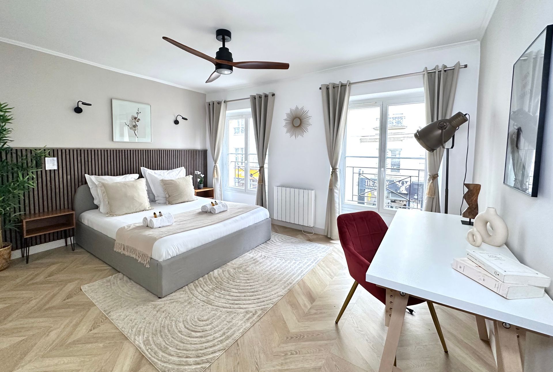 A cosy and comfortable bedroom in the heart of Paris. Enjoy your stay with us during your holidays in France.