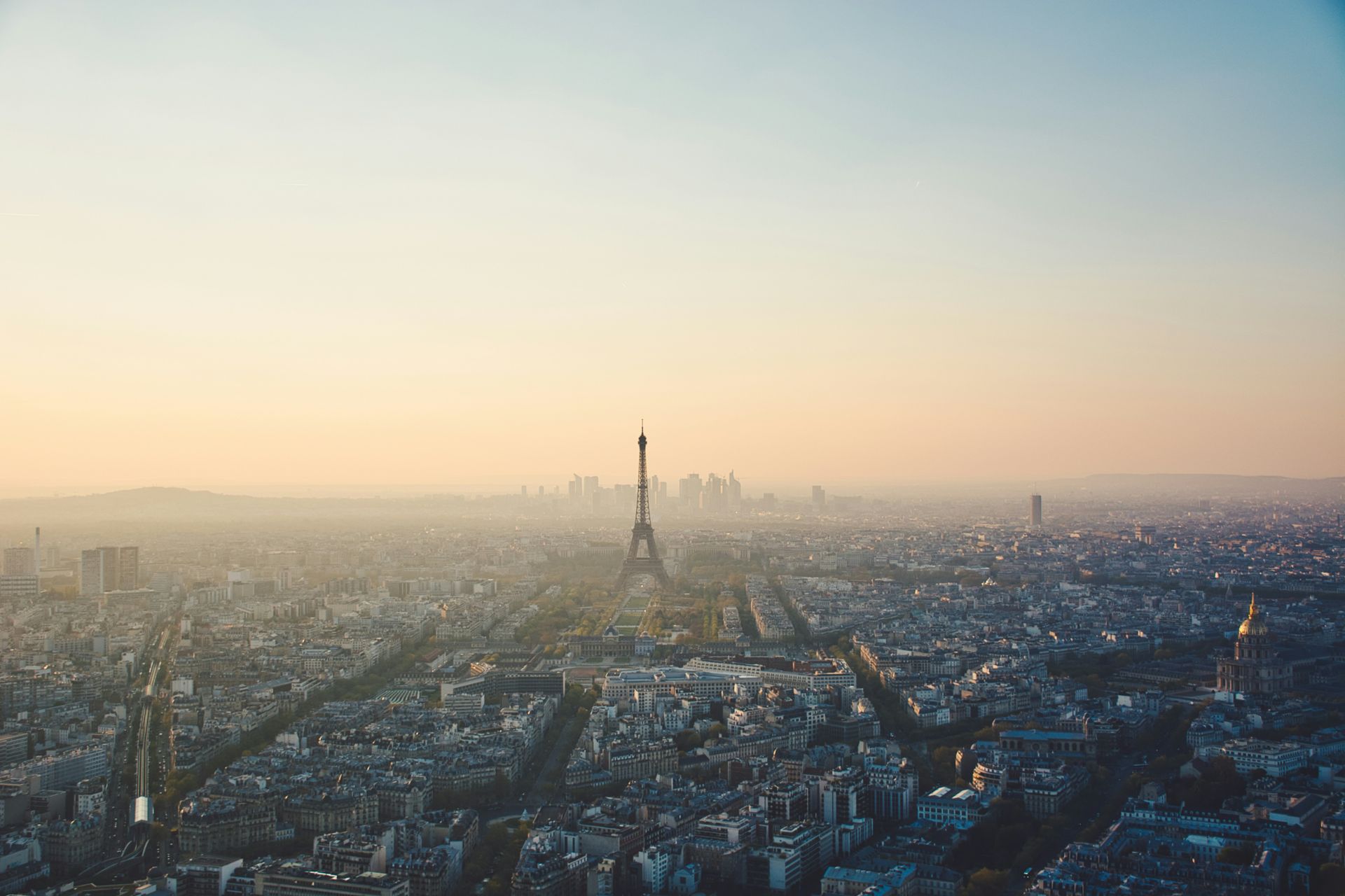 Aerial view of Paris during the sunset with the Eiffel Tower in the centre. 