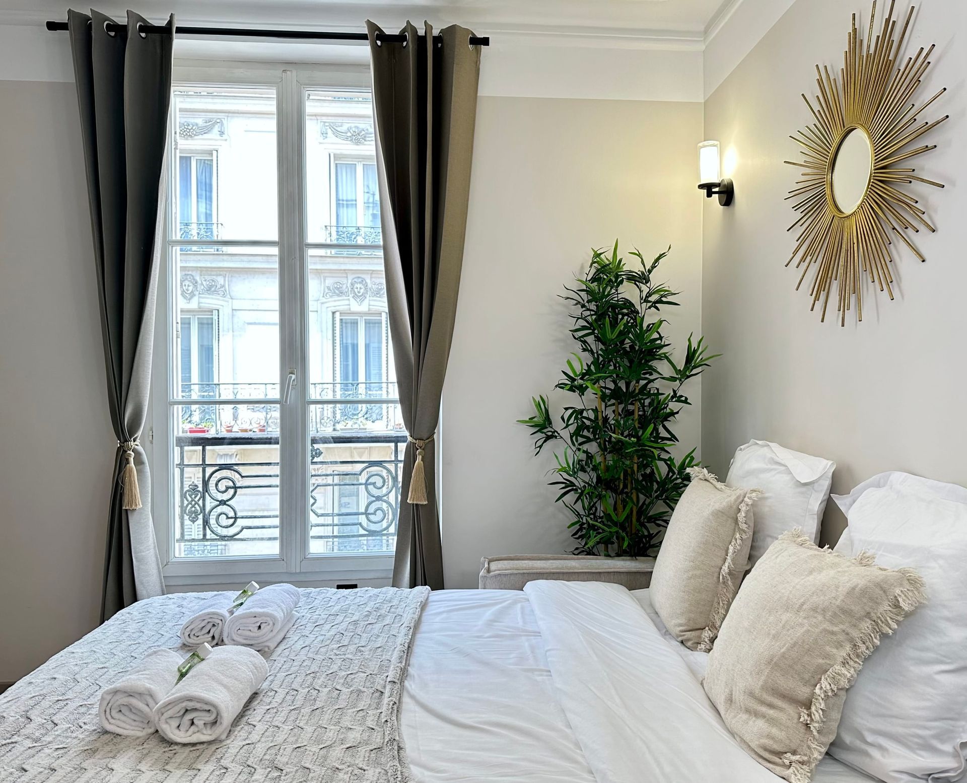 A cosy and luxurious bedroom in the heart of Paris with a view. Enjoy your stay with us during your holidays in France.