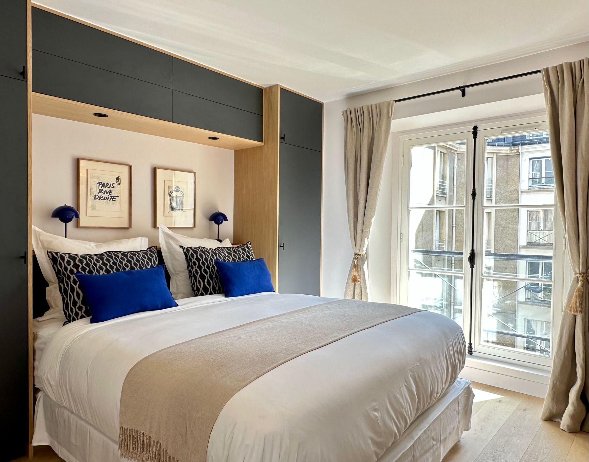 A cosy and comfortable bedroom in the heart of Paris. Enjoy your stay with us during your holidays in France.