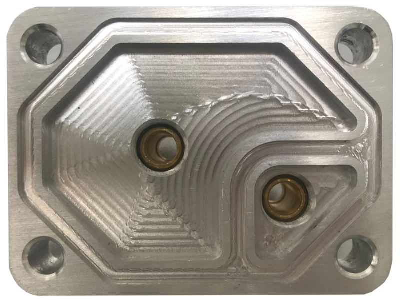 Eine Nahaufnahme einer Metallplatte mit zwei Löchern auf einem weißen Hintergrund.