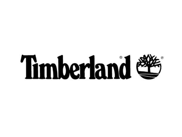Un logotipo en blanco y negro para Timberland con un árbol encima.