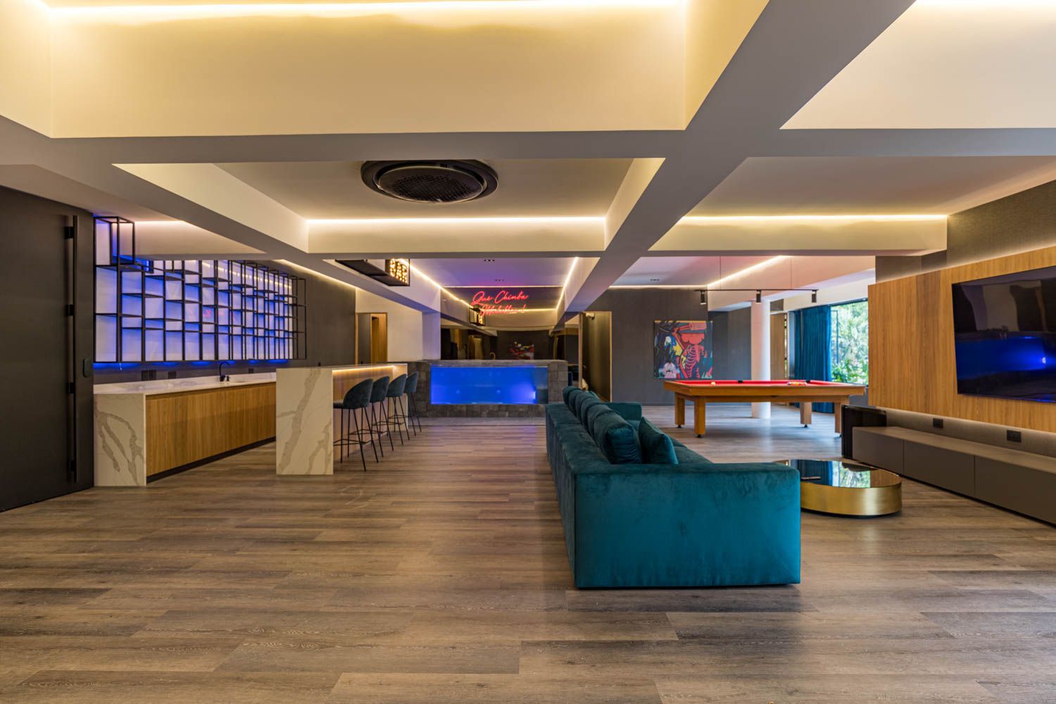 A large house with a swimming pool and a wooden deck