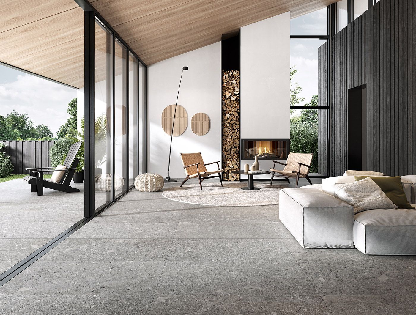 Terratinta - un salon avec un sol gris et des canapés clairs