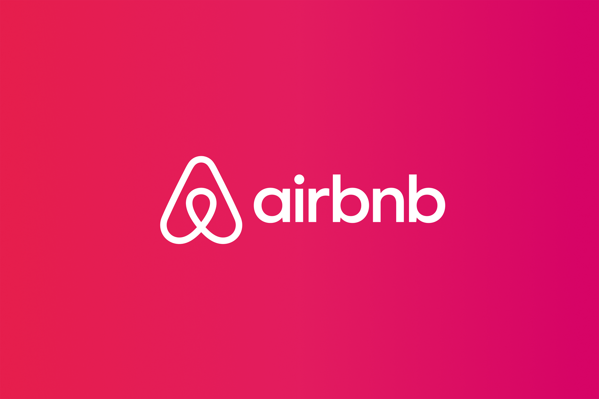 Airbnb logo with a white symbol on a red-pink gradient background.