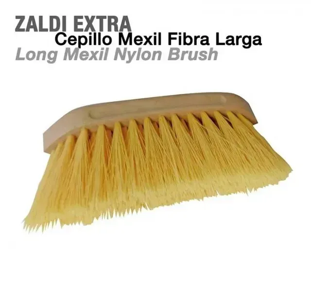 Cepillo de limpieza de nailon amarillo con base de madera, etiquetado como “Zaldi Extra Cepillo Mexil Fibra Larga”.