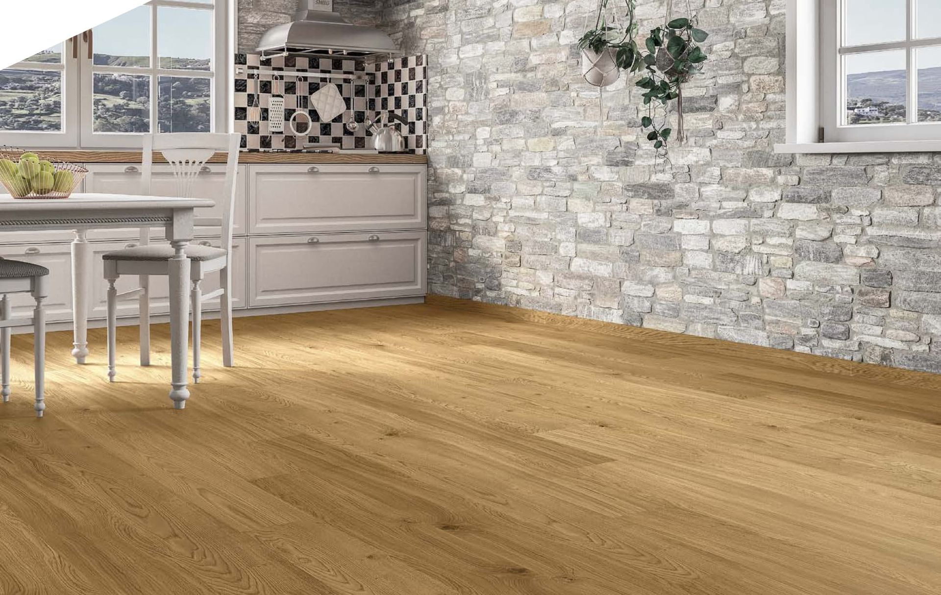 Una cocina con suelo de madera y pared de ladrillo.