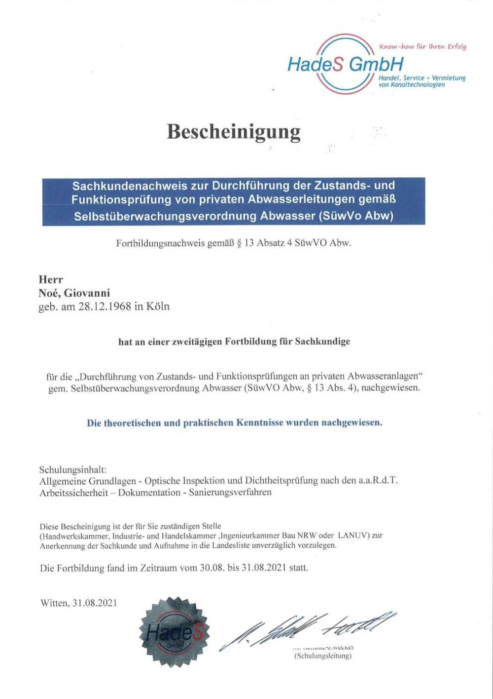 Ein weißes Blatt mit blauem Rand und dem Wort Bescheinigung darauf