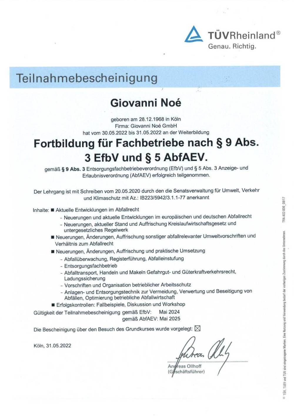 Eine schwarz-weiße Urkunde mit blauem Rand und einer Unterschrift darauf.