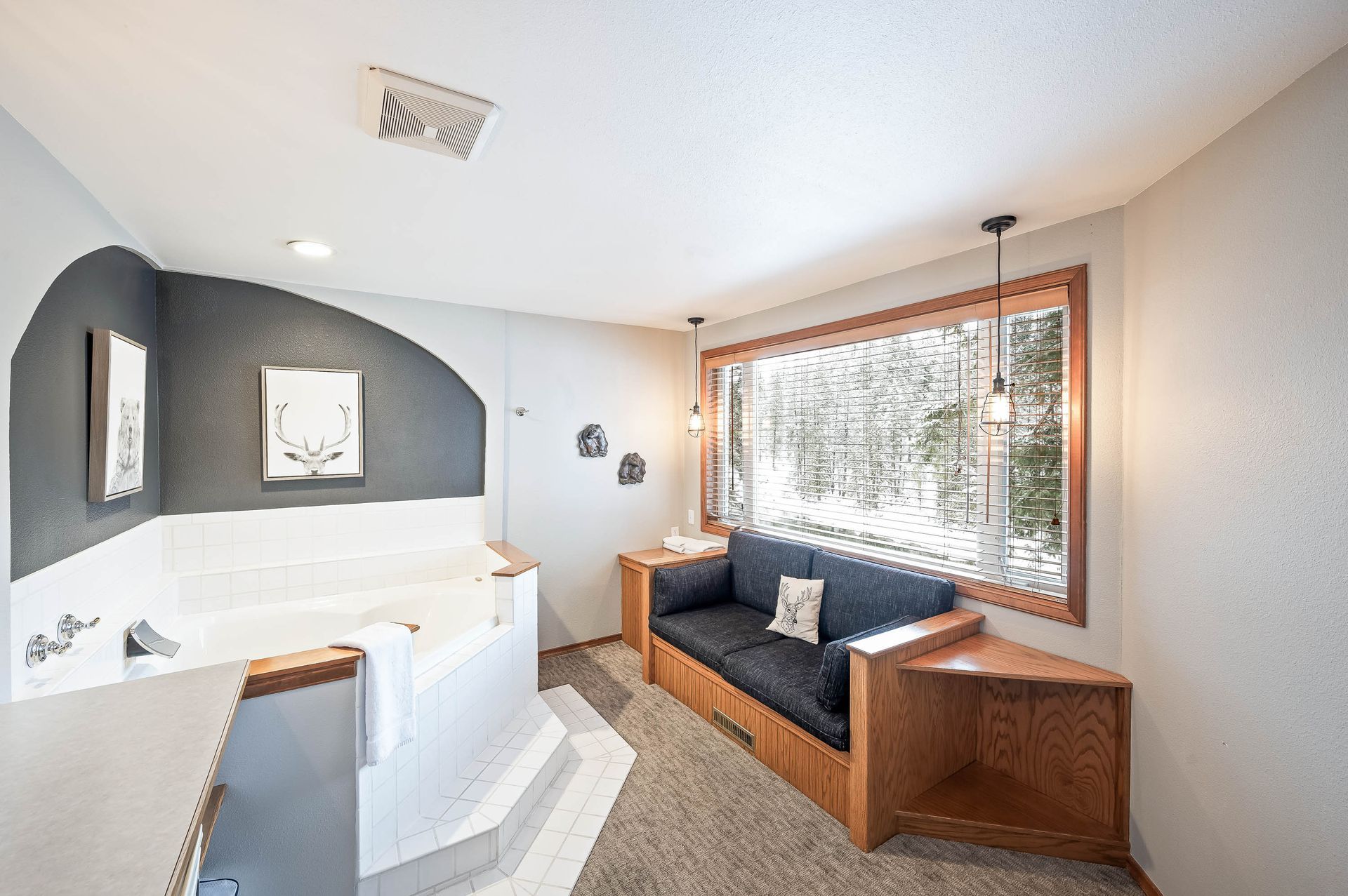 A living room with a jacuzzi tub and a couch