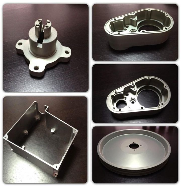 Uma colagem de diferentes tipos de peças de metal sobre uma mesa