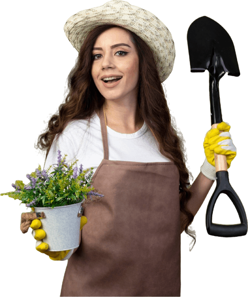 Eine Frau in einer roten Jacke gießt Blumen auf einem Friedhof. Karl Müller Garten- und Landschaftsbau