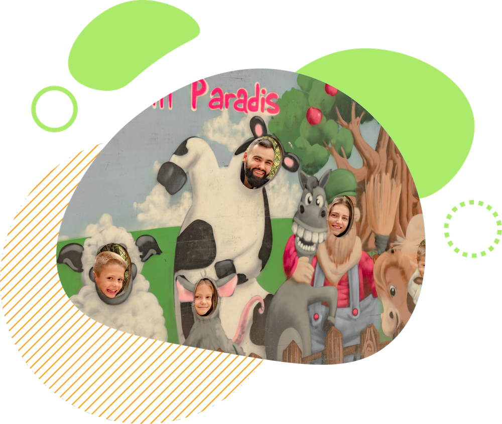 Des personnes posent pour une photo devant une silhouette d'animaux de la ferme.