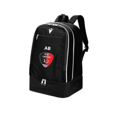 Sac à dos noir avec bordures blanches et logo en forme de bouclier rouge et noir, présenté sur fond blanc.