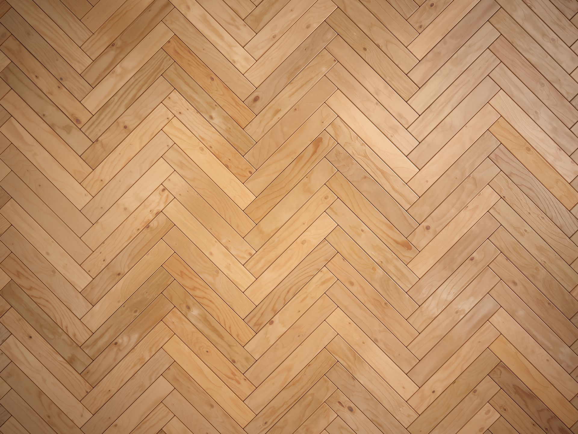Texture de parquet à chevrons beige clair avec un motif géométrique discret.