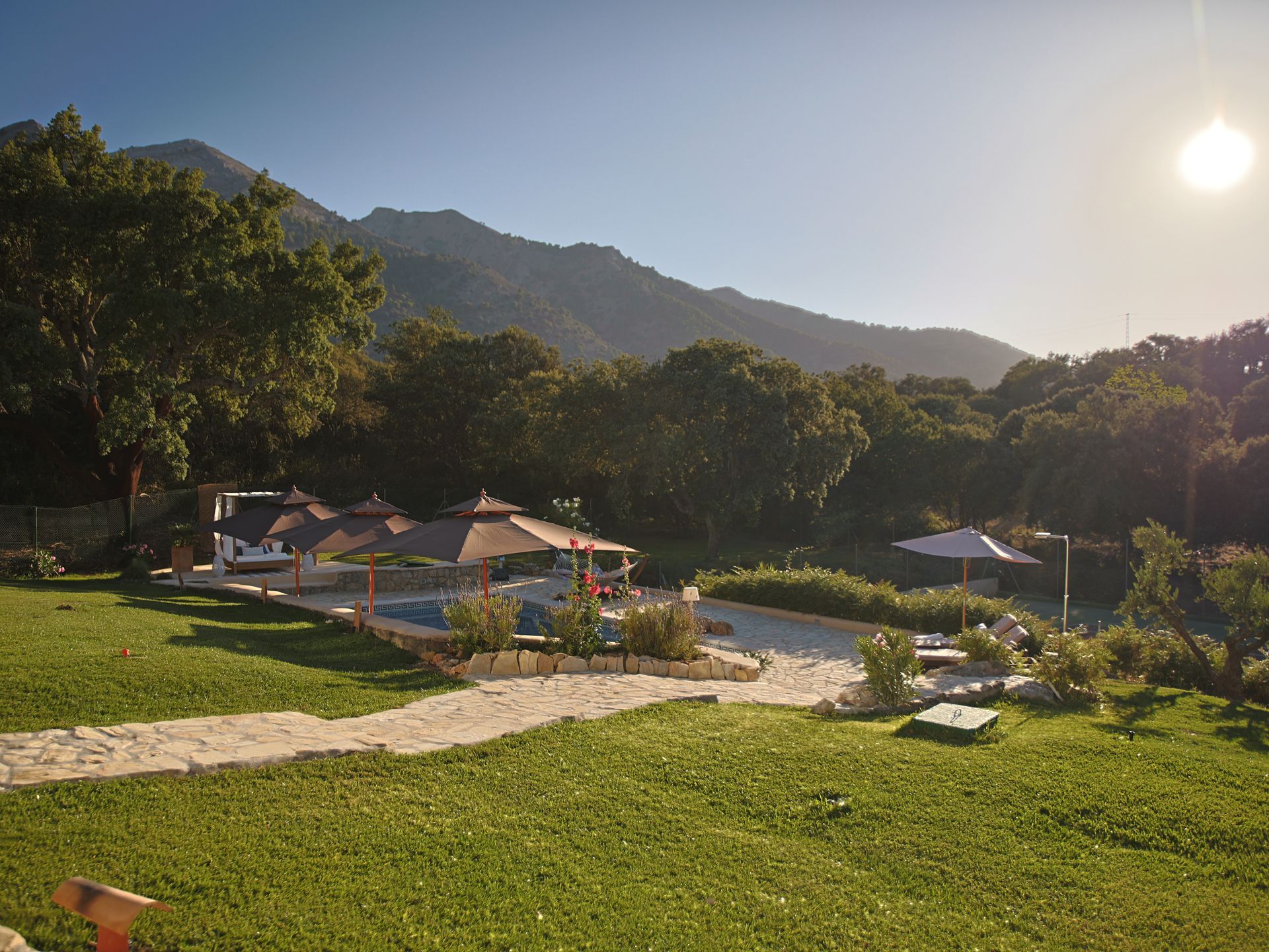 Panoramic view of the private estate and pool with Andalusian mountains