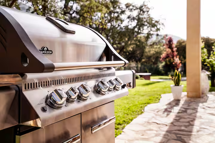 Close-up of the stainless steel Napoleon gas grill on the terrace