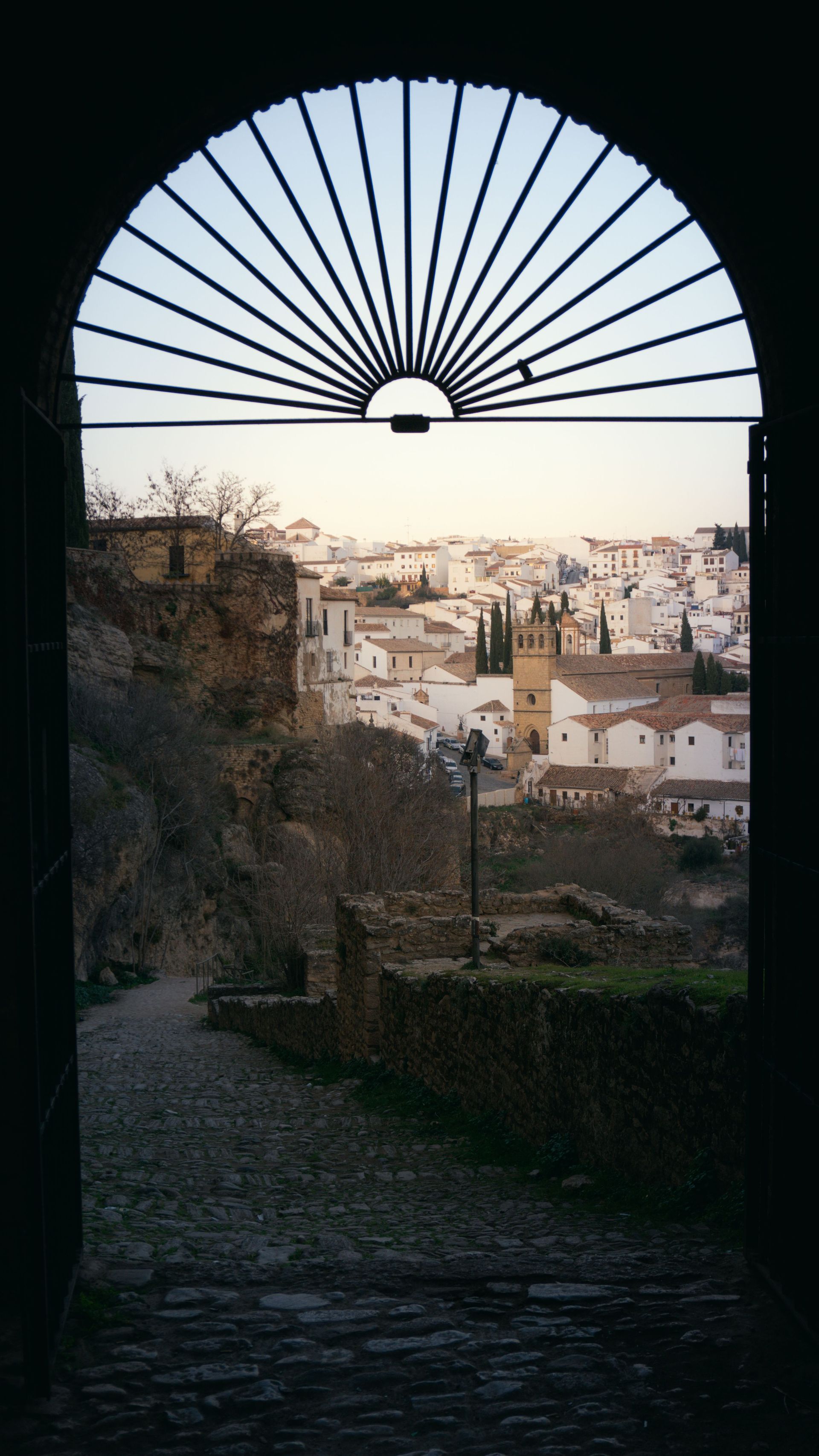 Traditional Andalusian arched window with wrought iron grille