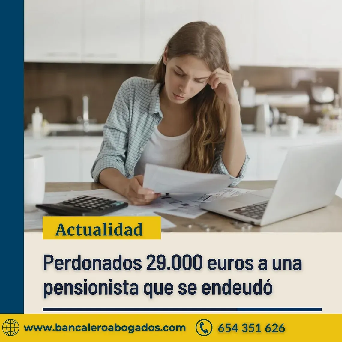 A woman is sitting at a table with a laptop and a calculator