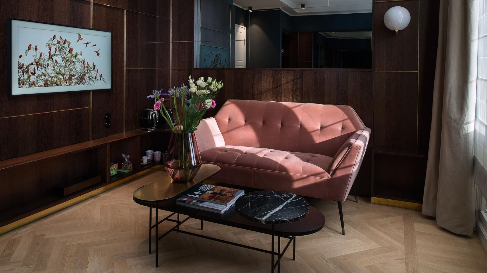 There is a couch and a coffee table in the Canal Suite.