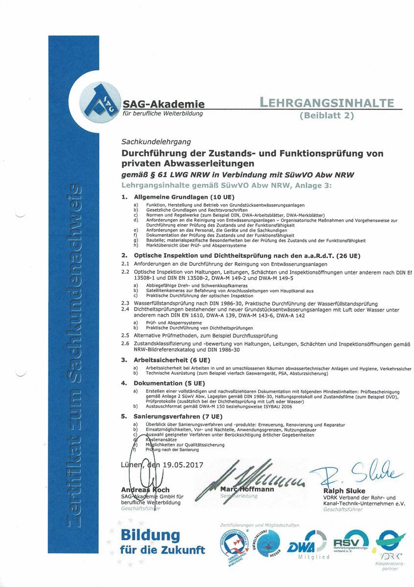 Eine blau-weiße Urkunde mit einer Unterschrift darauf.