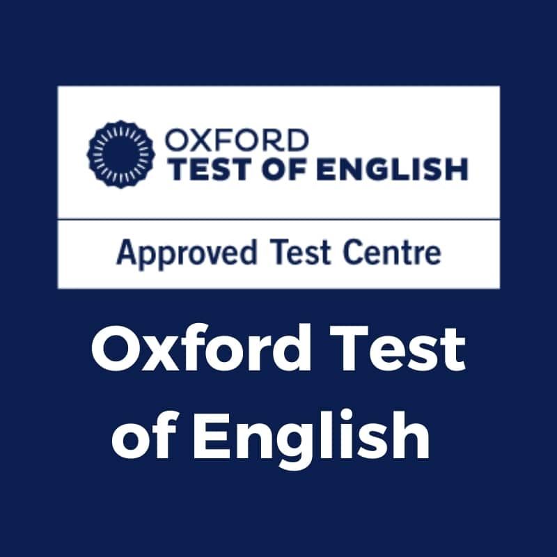 Letrero azul de centro de exámenes aprobado por Oxford Test of English con logotipo y texto blanco.