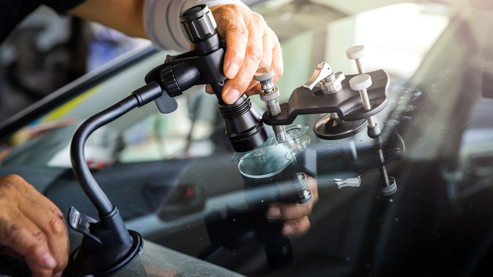 Injection d'une résine dans un pare-brise