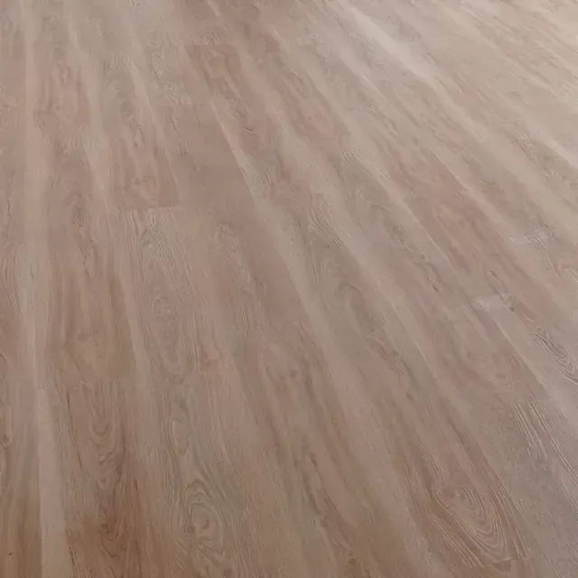 Un primer plano de un piso de madera en una habitación.