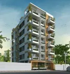 Edificio residencial de varios pisos con balcones, con un diseño moderno y plantas verdes, bajo un cielo azul.