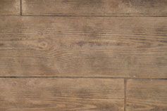 Un primer plano de un piso de madera con una textura granulada.