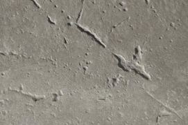 Un primer plano de una superficie de hormigón gris con textura.