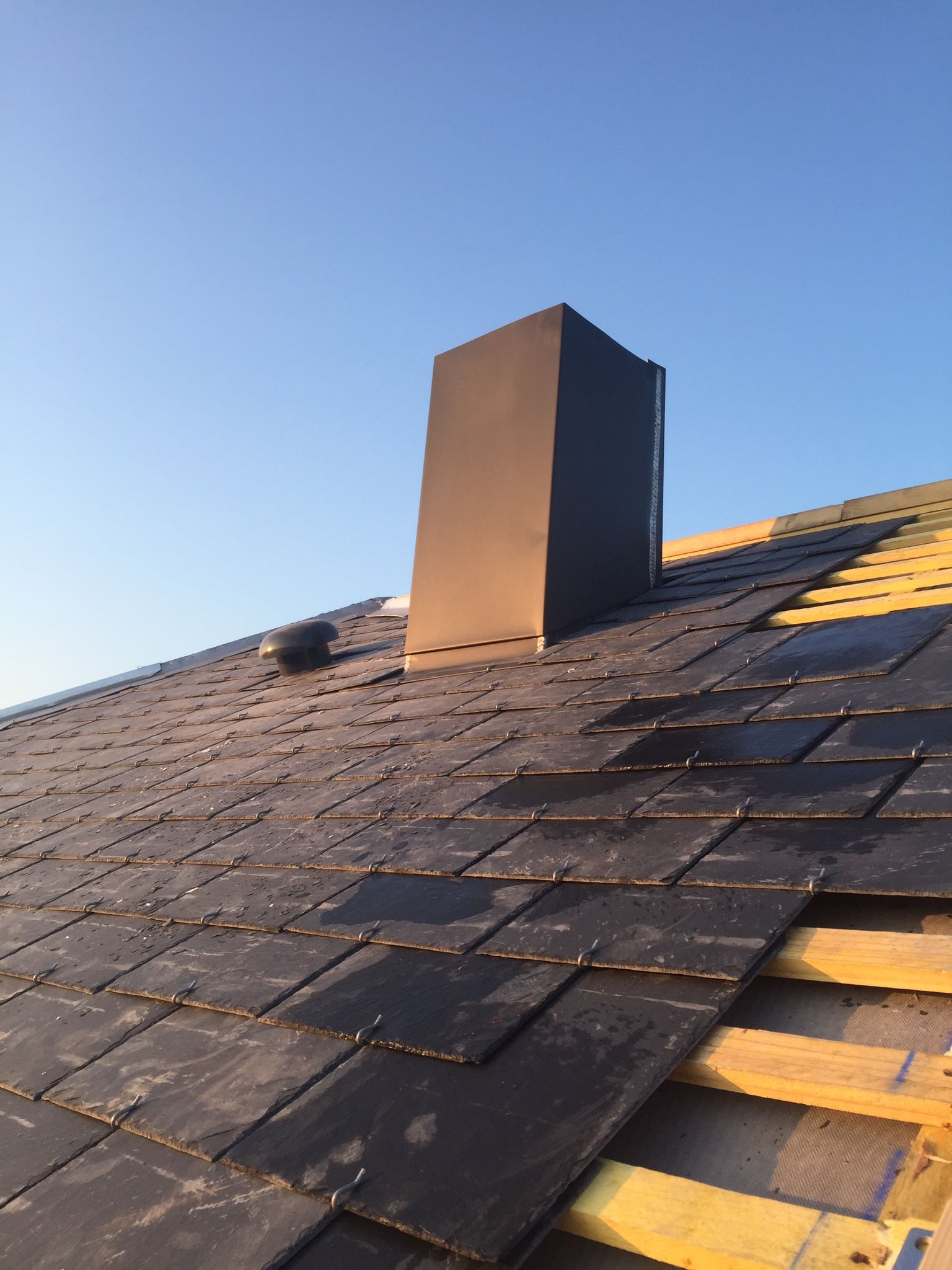 Pose d'ardoise et tour de cheminée