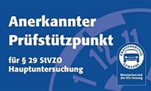 A blue sign that says ' anerkannter prüfstutzpunkt ' on it