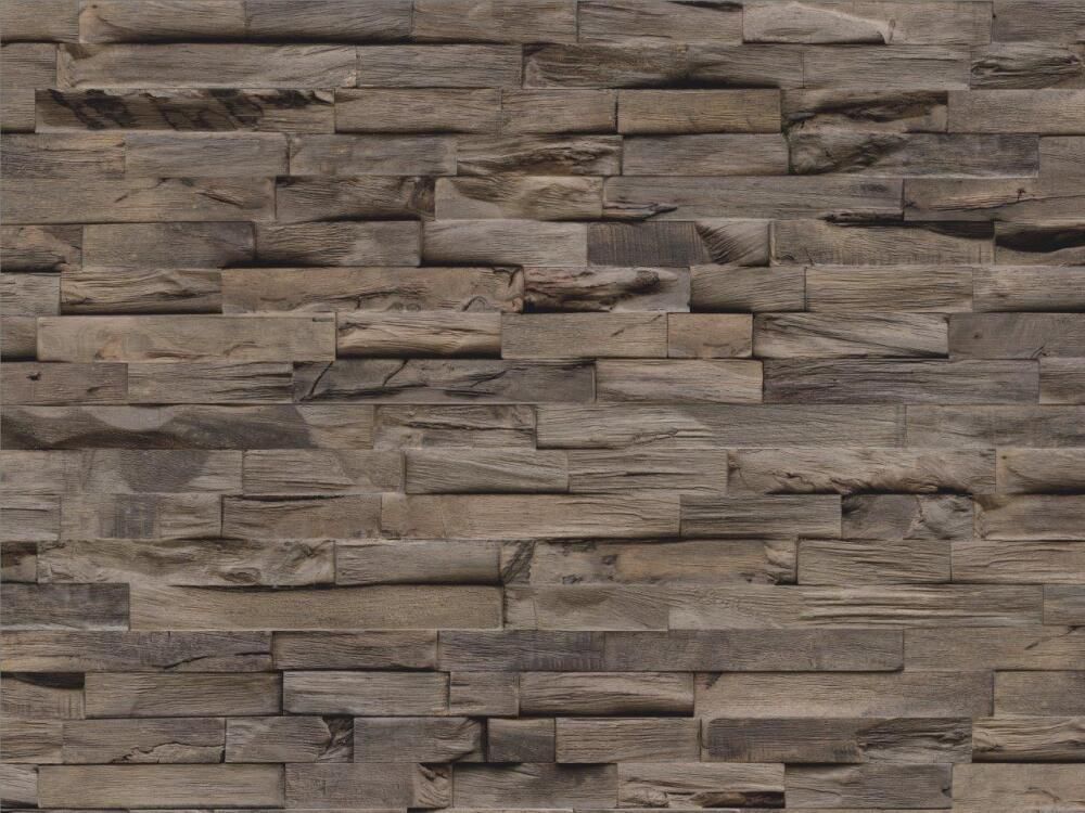 Eine Nahaufnahme einer Steinmauer mit Ziegelstruktur.