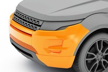 Un primer plano de un coche gris y naranja sobre un fondo blanco.