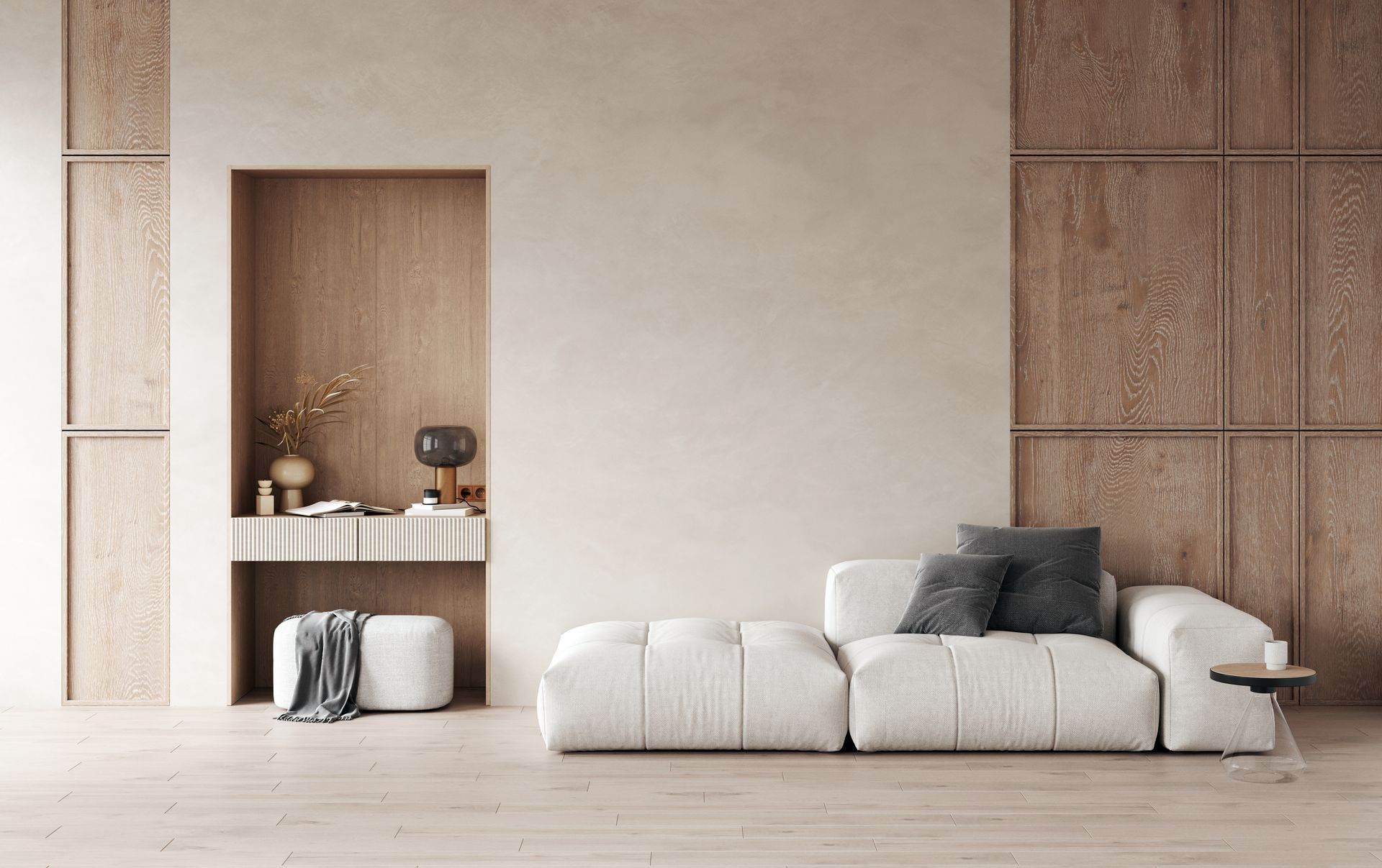 Un salon minimaliste avec un canapé blanc bas, des lambris en bois et une alcôve en retrait avec un tabouret blanc.