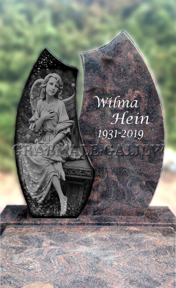 Ein Grabstein mit dem Bild eines Engels darauf.