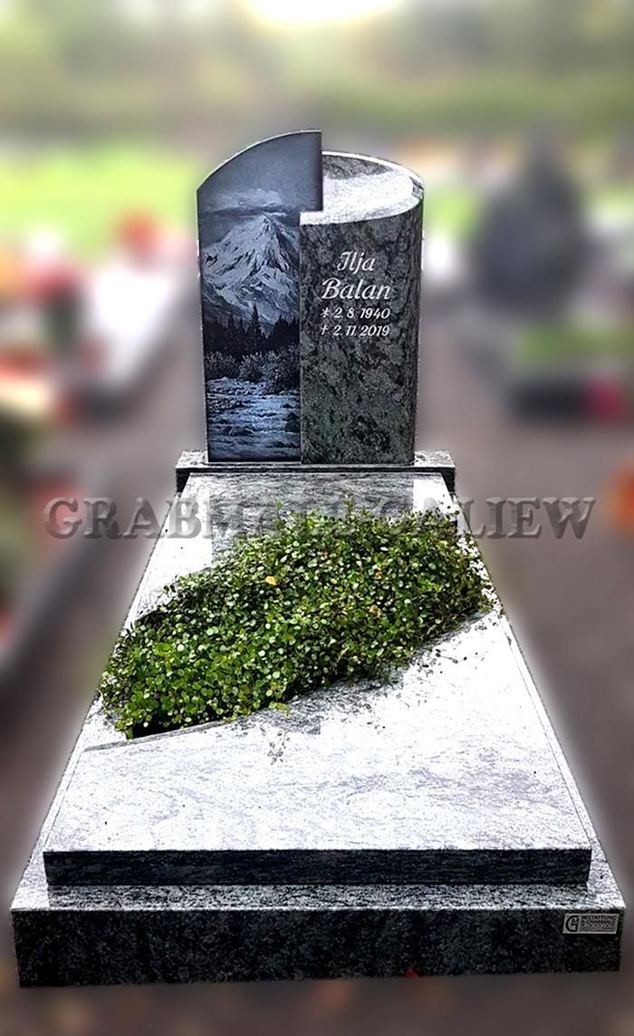 Ein Grabstein mit einem Busch darauf auf einem Friedhof.