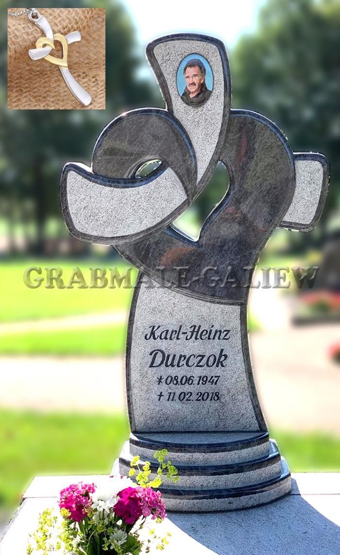 Ein Grabstein mit dem Bild eines Mannes darauf