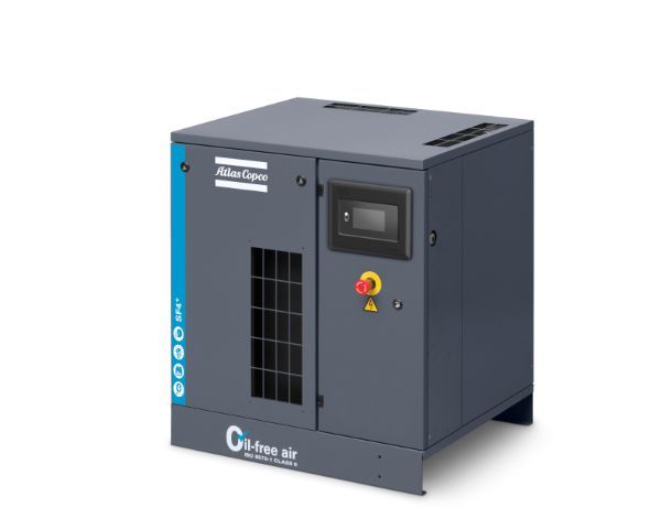 Ein grauer, ölfreier Atlas Copco Kompressor mit Bedienfeld und Not-Aus-Schalter.