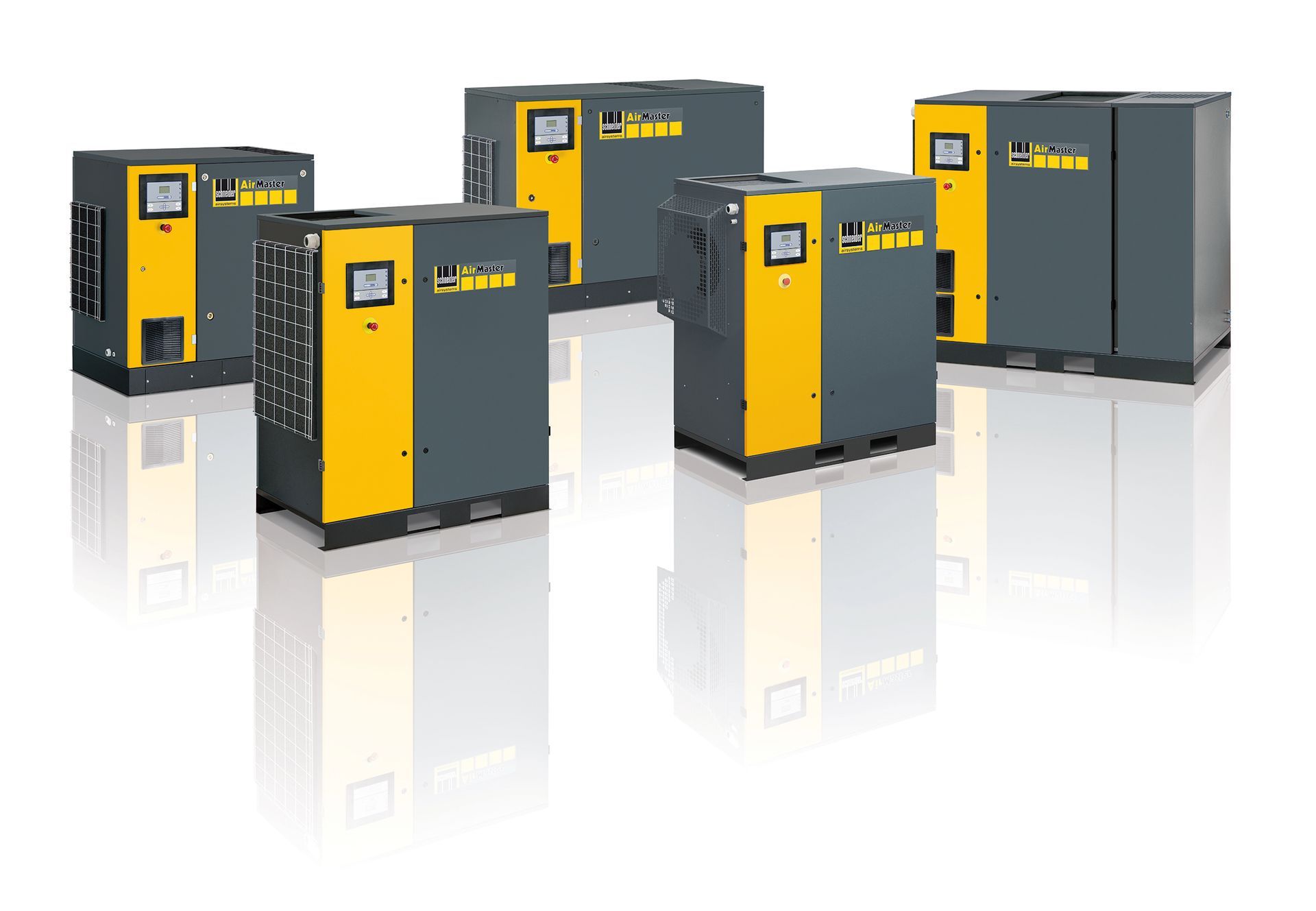 Mehrere industrielle Luftkompressoren, überwiegend grau und gelb, auf weißem Untergrund.