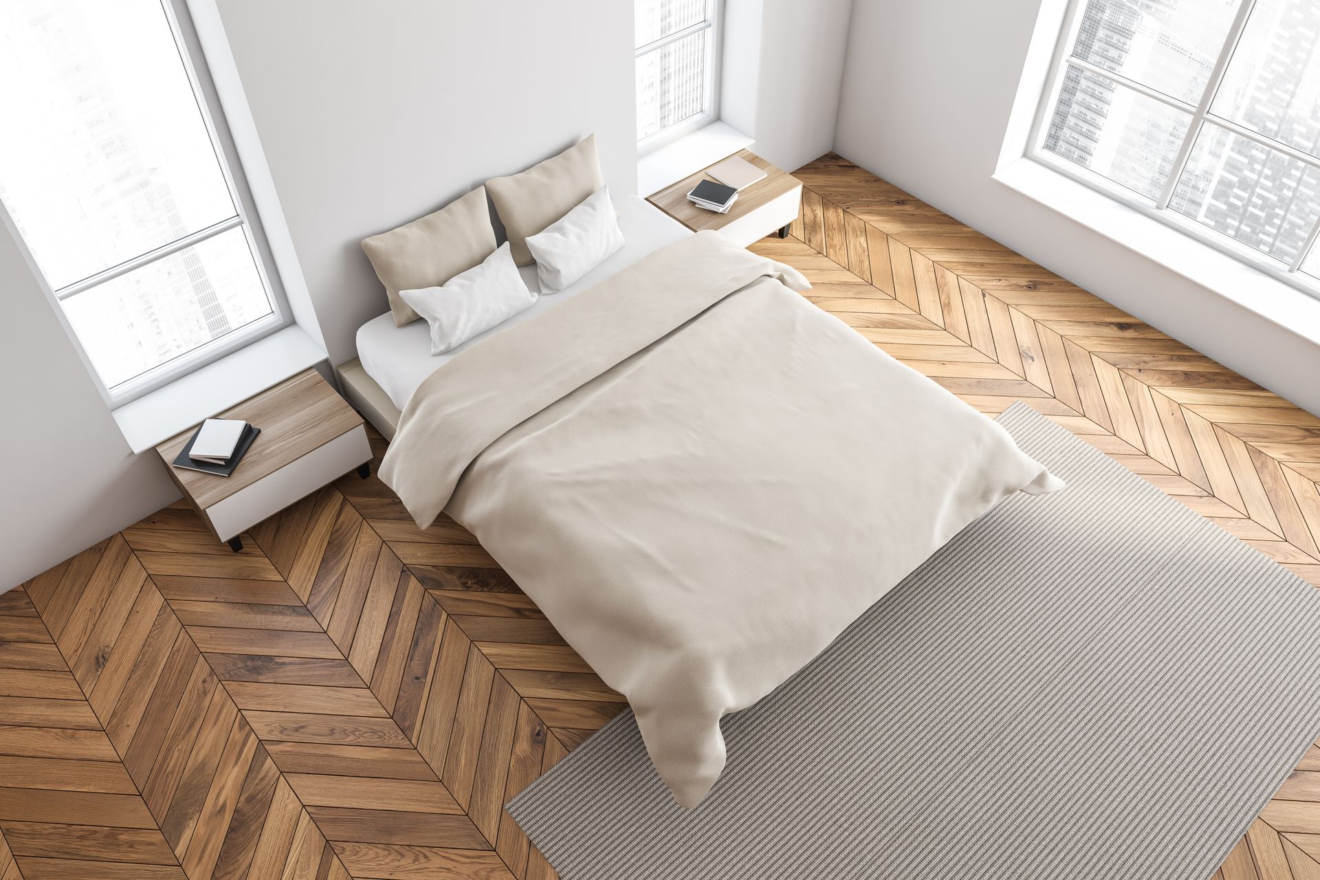 Chambre minimaliste avec un lit, du linge de lit beige, un parquet à chevrons et de grandes fenêtres sur deux côtés.