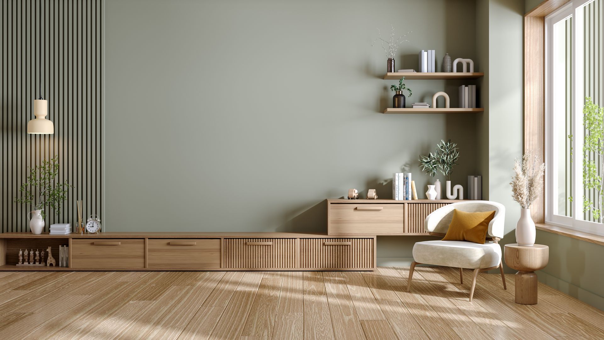 Salon moderne et minimaliste avec parquet, meubles bas, étagères et fauteuil près d'une fenêtre lumineuse.